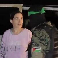 Hostage Rimon Buchshtab-Kirscht speaks to her Hamas captor as she is being released to the Red Cross in Gaza, November 28, 2023. (Screenshot via Al Jazeera)