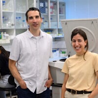 Dr. Ariel Afek, left, and doctoral student Noga Levy at Afek's lab at the Weizmann Institute of Science. (Courtesy/Weizmann Institute of Science)