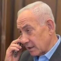 Prime Minister Benjamin Netanyahu speaks on the phone during a campaign video released on August 23, 2026. (X Screenshot)