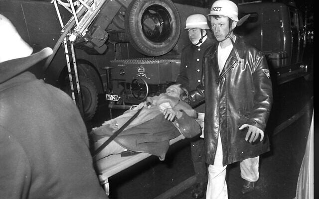 Emergency services evacuate residents of a Jewish retirement home in Munich after it was targeted in an arson attack on February 13, 1970, in which seven Holocaust survivors were killed. (IMAGO/Heinz Gebhardt via Reuters Connect)