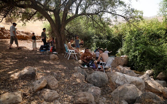 Israelis visit the Fasayil springs near the Palestinian village Fasayil, where residents say that Israeli settlers diverted water from the spring causing crops to die, in the West Bank, August 9, 2026. (Mohamad Torokman/Reuters)