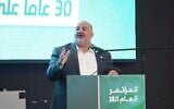 Ra’am chairman MK Mansour Abbas addresses party delegates at their convention in Taibe, August 22, 2026. (Facebook)