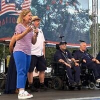 Rep. Debbie Wasserman Schultz (D-Florida) takes the stage alongside some of the city's commissioners at a Fourth of July celebration on July 4, 2026 in Sunrise, Fla. (Teo Armus/TWP via Getty Images via JTA)