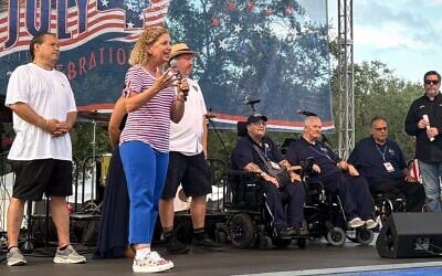 Rep. Debbie Wasserman Schultz (D-Florida) takes the stage alongside some of the city's commissioners at a Fourth of July celebration on July 4, 2026 in Sunrise, Fla. (Teo Armus/TWP via Getty Images via JTA)