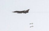 This handout picture released by Iran’s Army office on July 24, 2023, shows an Islamic Republic of Iran Air Force Sukhoi Su-24 tactical bomber aircraft releasing bombs during the Fadayeeyan Hareem Velayat aerial exercise in Iran. (Iranian Army office/AFP)