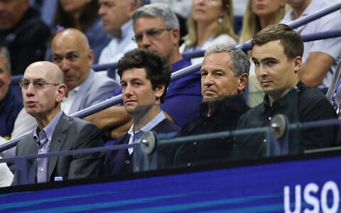NBA Commissioner Adam Silver (L), Joshua Kushner (2nd-L) and Disney CEO Bob Iger (2nd-R) attend a US Open match at USTA Billie Jean King National Tennis Center on September 2, 2025, in the Flushing neighborhood of the Queens borough of New York City. (Sarah Stier/Getty Images/AFP)