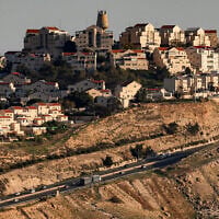 This picture taken from the E1 area northeast of Jerusalem shows vehicles moving along a highway near the West Bank settlement of Ma'ale Adumim on February 4, 2026. (AHMAD GHARABLI/AFP)
