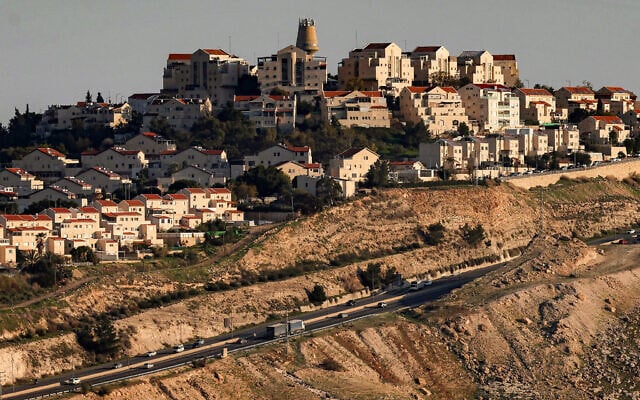 This picture taken from the E1 area northeast of Jerusalem shows vehicles moving along a highway near the West Bank settlement of Ma'ale Adumim on February 4, 2026. (AHMAD GHARABLI/AFP)