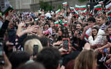 Bulgarian singer Dara (C) greets fans as she performs during a concert in front of National Gallery of Art after winning the Eurovision Song Contest with her song “Bangaranga” in Sofia on May 19, 2026. (Nikolay Doychinov/AFP)