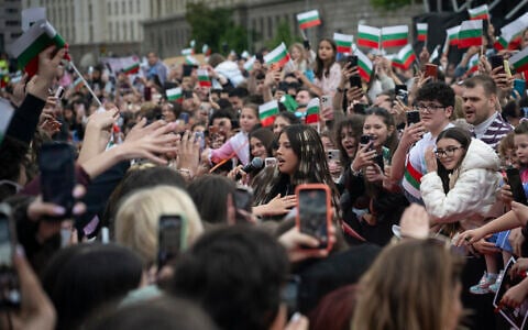 Bulgarian singer Dara (C) greets fans as she performs during a concert in front of National Gallery of Art after winning the Eurovision Song Contest with her song “Bangaranga” in Sofia on May 19, 2026. (Nikolay Doychinov/AFP)