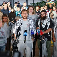 Members of a Gaza-bound flotilla, who were detained by Israeli security forces, speak during a press conference after arriving at Sydney International Airport on May 25, 2026. (DAVID GRAY/AFP)