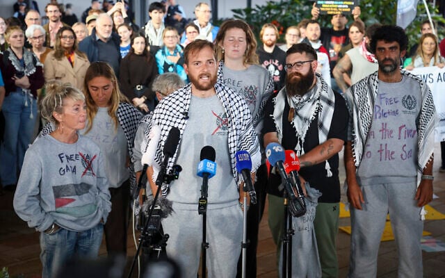 Members of a Gaza-bound flotilla, that were detained by Israeli security forces, speak during a press conference after arriving at Sydney International Airport on May 25, 2026. (DAVID GRAY/AFP)