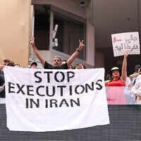 Fans holds the banner reading ‘Stop Executions in Iran’ before the FIFA World Cup 2026 Group G match between Belgium and Iran at Los Angeles Stadium on June 21, 2026 in Inglewood, California. (Stu Forster/Getty Images/AFP)