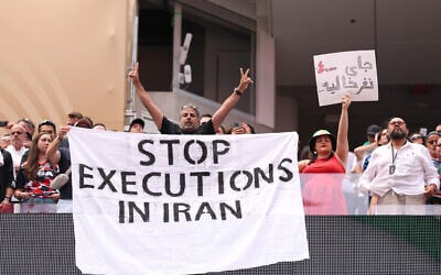 Fans holds the banner reading ‘Stop Executions in Iran’ before the FIFA World Cup 2026 Group G match between Belgium and Iran at Los Angeles Stadium on June 21, 2026 in Inglewood, California. (Stu Forster/Getty Images/AFP)