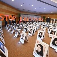 Iranian protesters hold letters spelling out “Stop Execution” as they gather at the Ergife Palace Hotel to condemn the silence of Western governments in the face of the growing wave of Iranian political executions, in Rome, Italy, on July 16, 2026. (Andreas SOLARO/AFP)