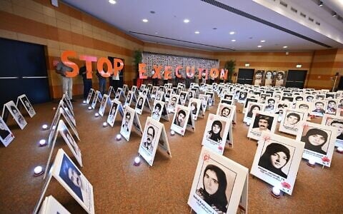 Iranian protesters hold letters spelling out “Stop Execution” as they gather at the Ergife Palace Hotel to condemn the silence of Western governments in the face of the growing wave of Iranian political executions, in Rome, Italy, on July 16, 2026. (Andreas SOLARO/AFP)