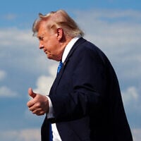 US President Donald Trump flashes a thumbs up while stepping off Air Force One upon arrival at Morristown Municipal Airport in Morristown, New Jersey, July 31, 2026. (Aaron Schwartz/AFP)