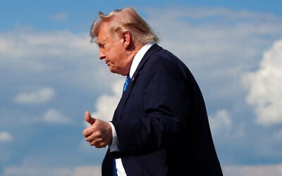 US President Donald Trump flashes a thumbs up while stepping off Air Force One upon arrival at Morristown Municipal Airport in Morristown, New Jersey, July 31, 2026. (Aaron Schwartz/AFP)