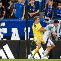 Sébastian Breza of CF Montréal pushes Dor Turgeman of the New England Revolution, after he celebrated a goal in front of the Montreal fans during the first half, at Saputo Stadium in Montreal, August 1, 2026. (Tim Austen / GETTY IMAGES NORTH AMERICA / Getty Images via AFP)