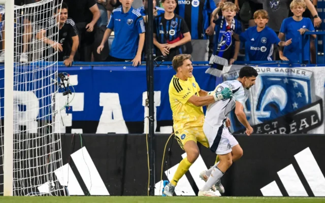 Sébastian Breza of CF Montréal pushes Dor Turgeman of the New England Revolution, after he celebrated a goal in front of the Montreal fans during the first half, at Saputo Stadium in Montreal, August 1, 2026. (Tim Austen / GETTY IMAGES NORTH AMERICA / Getty Images via AFP)