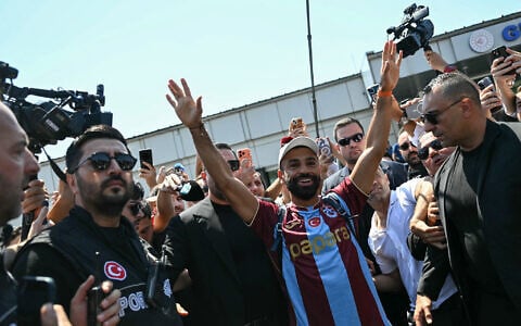 Egyptian forward Mohamed Salah gestures as he arrives at Istanbul Ataturk Airport to complete his transfer to Turkish football club Trabzonspor in Istanbul on August 5, 2026. (Ozan KOSE/AFP)
