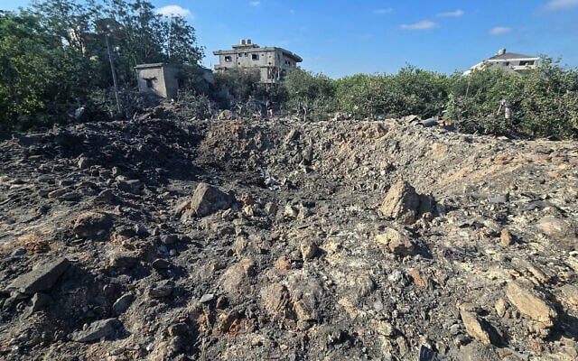 A photograph shows a crater left by an overnight Israeli airstrike that targeted a house in the area of Burj al-Shamali, near Tyre, on August 6, 2026. (Kawnat HAJU/AFP)