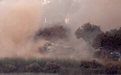 This photograph taken from the southern Lebanese village of Zawtar al-Gharbiyah shows an Israeli tank maneuvering in the nearby village of Zawtar al-Sharqiyah, on August 7, 2026. (Ammar Ammar/AFP)