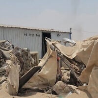 This frame grab taken from AFPTV video footage on August 7, 2026, shows a boy standing near the damage at Mail al-Saila internally displaced camp (IDP) on the outskirts of Marib following a reported Houthi ballistic missile attack on the government-held city of Marib early August 7, amid an escalation in hostilities. (AFPTV/AFP)