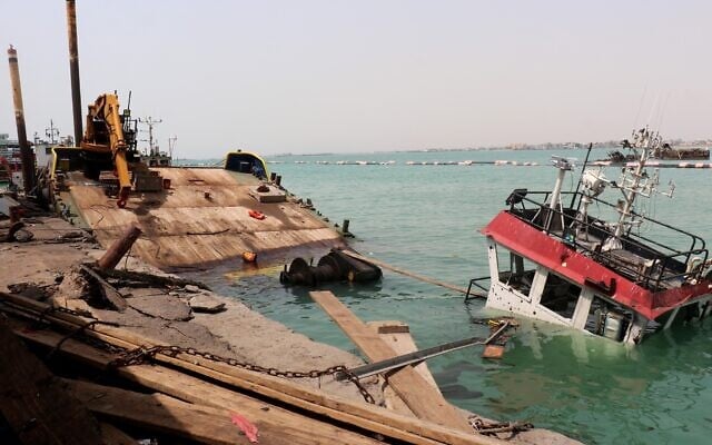The navigation bridge of a sunken vessel is all that is seen at the surface of the water in the Port of Mokha, the day after an attack by the Houthis on the city Mokha, held by Yemen’s internationally recognized, Aden-based government on August 10, 2026. (Khaled ZIAD/AFP)
