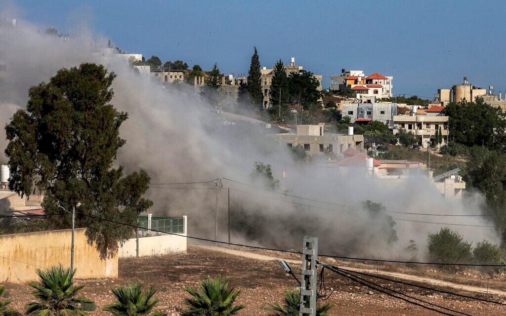 Smoke rises during an Israeli controlled-demolition from the home of Palestinian Farouk Ramadan, who opened fire with a gun snatched from an Israeli security officer during a deadly gunbattle involving settlers and Palestinians on July 24, in the West Bank village of Tell, on August 11, 2026. (Jaafar ASHTIYEH/AFP)