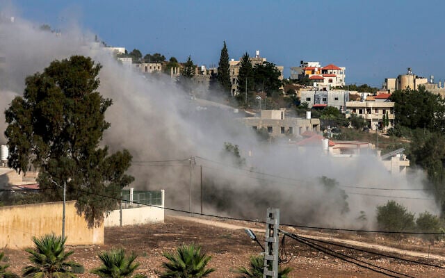 Smoke rises during an Israeli controlled-demolition from the home of Palestinian Farouk Ramadan, who opened fire with a gun snatched from an Israeli security officer during a deadly gunbattle involving settlers and Palestinians on July 24, in the West Bank village of Tell, on August 11, 2026. (Jaafar ASHTIYEH/AFP)