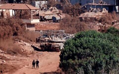 A photograph taken from the southern Lebanese viallage of of Zawtar al-Gharbiyah shows Israeli troops stationed in the nearby village of Zawtar al-Charkiyah on August 11, 2026. (Ammar Ammar/AFP)