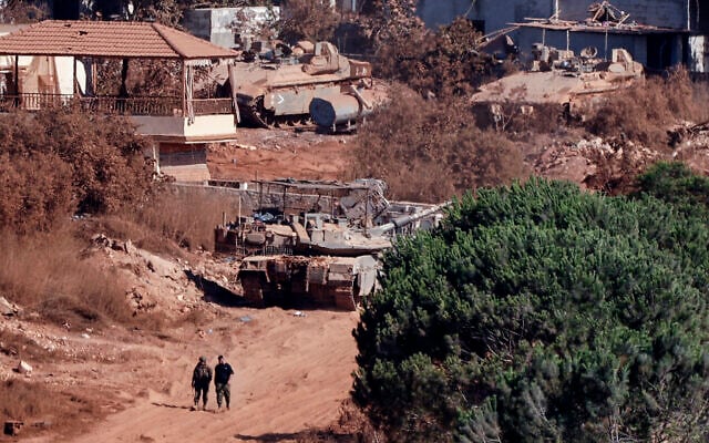 A photograph taken from the southern Lebanese viallage of of Zawtar al-Gharbiyah shows Israeli troops stationed in the nearby village of Zawtar al-Charkiyah on August 11, 2026. (Ammar Ammar/AFP)