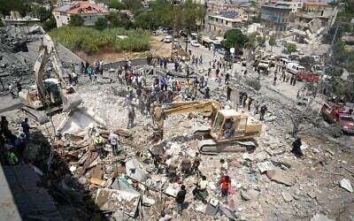 Heavy machinery, first aid responders and residents search the site of an Israeli airstrike that targeted a neighborhood in the southern Lebanese village of Deir al-Zahrani on August 15, 2026. (Abbas FAKIH/AFP) Heavy machinery, first aid responders and residents search the site of an Israeli airstrike that targeted a neighborhood in the southern Lebanese village of Deir al-Zahrani on August 15, 2026. (Abbas FAKIH/AFP)