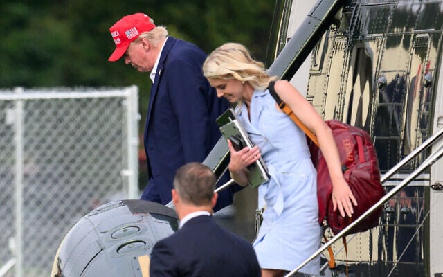 US President Donald Trump and aide Natalie Harp (R) exit Marine One on the Ellipse near the White House on August 16, 2026. (Mandel NGAN/AFP) US President Donald Trump and aide Natalie Harp (R) exit Marine One on the Ellipse near the White House on August 16, 2026. (Mandel NGAN/AFP)