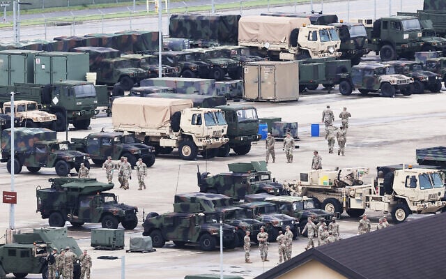 US soldiers are seen near military vehicles at Camp Humphreys in Pyeongtaek, South Korea, on August 17, 2026. (YONHAP/AFP) US soldiers are seen near military vehicles at Camp Humphreys in Pyeongtaek, South Korea, on August 17, 2026. (YONHAP/AFP)