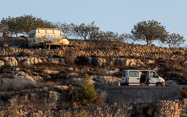 FILE: Vehicles used by Israeli right-wing settlers in the West Bank village of Qusra are pictured outside the homes they are besieging in the village on August 18, 2026. (Ilia YEFIMOVICH/AFP)