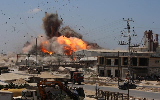 Smoke and a fireball rise during an Israeli strike, carried out after the military warned Palestinian residents to evacuate the area of  al-Zawayda, in the central Gaza Strip, on August 23, 2026. (Eyad Baba/AFP)