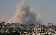 Smoke billows following Israeli demolition of residential structures east of Deir al-Balah in the central Gaza Strip on August 25, 2026. (Eyad Baba/AFP)