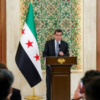 Mazloum Abdi, leader of the Kurdish-led Syrian Democratic Forces (SDF), speaks during a televised speech at the People’s Palace in Damascus on August 25, 2026. (Bakr Alkasem/AFP)