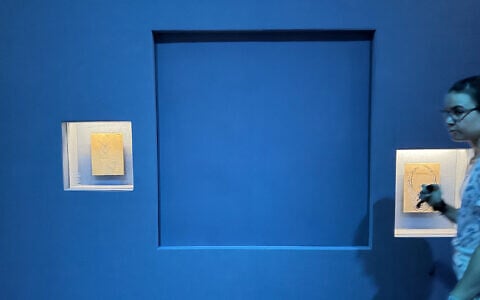 A blue panel covers the area where a display case was smashed and a Van Cleef and Arpels necklace was stolen at Vienna’s Museum of Applied Arts (MAK), in Vienna, Austria, on August 28, 2026. (Jeremy Audouard/AFP)