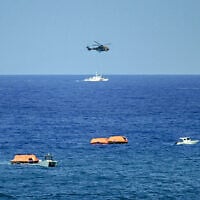Turkish vessels, aircraft, and rescue rafts are pictured off the port of Kyrenia in the self-proclaimed Turkish Republic of Northern Cyprus (TRNC) in the north of the divided Mediterranean island of Cyprus on August 30, 2026 during search and rescue operations following a ferry capsizing. (Jewel SAMAD/AFP)