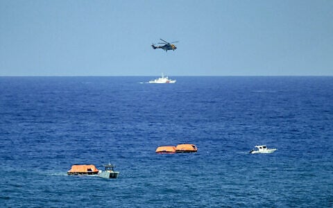 Turkish vessels, aircraft, and rescue rafts are pictured off the port of Kyrenia in the self-proclaimed Turkish Republic of Northern Cyprus (TRNC) in the north of the divided Mediterranean island of Cyprus on August 30, 2026 during search and rescue operations following a ferry capsizing. (Jewel SAMAD/AFP)