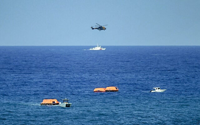 Turkish vessels, aircraft, and rescue rafts are pictured off the port of Kyrenia in the self-proclaimed Turkish Republic of Northern Cyprus (TRNC) in the north of the divided Mediterranean island of Cyprus on August 30, 2026 during search and rescue operations following a ferry capsizing. (Jewel SAMAD/AFP) Turkish vessels, aircraft, and rescue rafts are pictured off the port of Kyrenia in the self-proclaimed Turkish Republic of Northern Cyprus (TRNC) in the north of the divided Mediterranean island of Cyprus on August 30, 2026 during search and rescue operations following a ferry capsizing. (Jewel SAMAD/AFP)