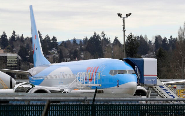 File: In this photo taken March 11, 2019, a TUI Boeing 737 MAX 8 airplane is seen parked at Boeing Co.’s Renton Assembly Plant in Renton, Washington (AP Photo/Ted S. Warren)