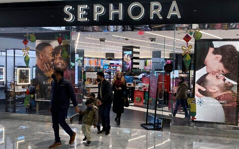 Illustrative: People leave a Sephora store in the Hudson Yards shopping mall in New York City on December 4, 2021. (AP Photo/Ted Shaffrey)