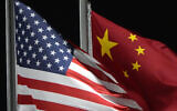 Illustrative: The American and Chinese flags wave at Genting Snow Park ahead of the 2022 Winter Olympics, in Zhangjiakou, China, on February 2, 2022. (AP Photo/Kiichiro Sato)
