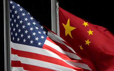 Illustrative: The American and Chinese flags wave at Genting Snow Park ahead of the 2022 Winter Olympics, in Zhangjiakou, China, on February 2, 2022. (AP Photo/Kiichiro Sato) Illustrative: The American and Chinese flags wave at Genting Snow Park ahead of the 2022 Winter Olympics, in Zhangjiakou, China, on February 2, 2022. (AP Photo/Kiichiro Sato)