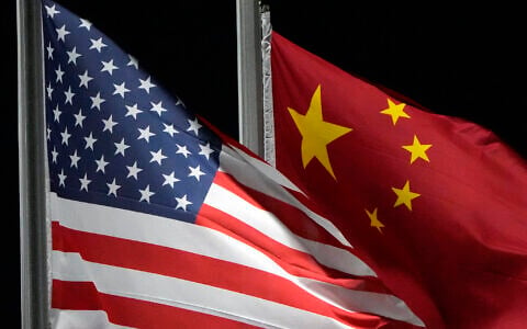 Illustrative: The American and Chinese flags wave at Genting Snow Park ahead of the 2022 Winter Olympics, in Zhangjiakou, China, on February 2, 2022. (AP Photo/Kiichiro Sato)