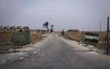 A Syrian army checkpoint stands abandoned near the Abu al-Duhur military airport, east of Idlib, after Syrian opposition fighters took control of the area on December 7, 2024. (AP/Omar Albam)